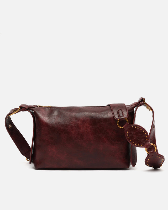 Gosti bolso bandolera pequeño con detalles metálicos