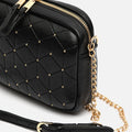 Reko bolso bandolera mini con detalles metálicos 